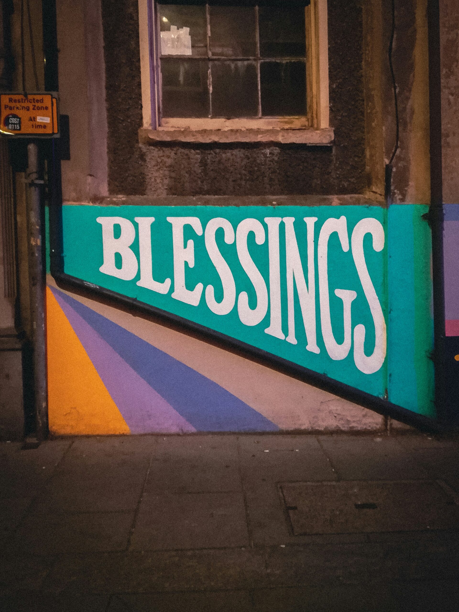 a sign on a building that says blessing
